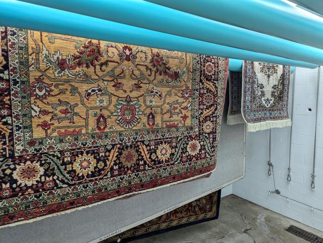 Cleaned Oriental rugs drying in the climate-controlled room