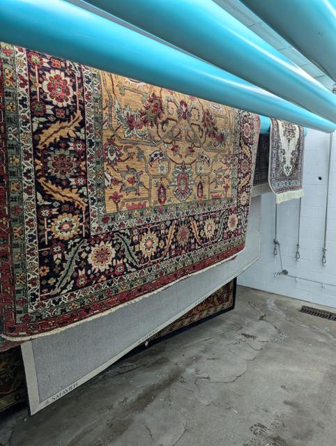 Persian rugs hanging to dry after washing