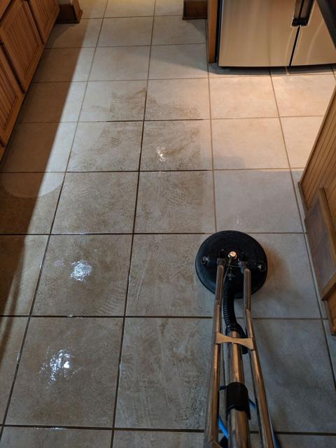 Rotary extraction tool cleaning tile and grout